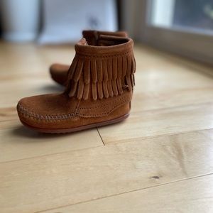 Minnetonka double fringe side zip , color brown